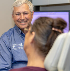 Dr charles felts consulting a patient about implants chattanooga tn chattanooga periodontics dental implants