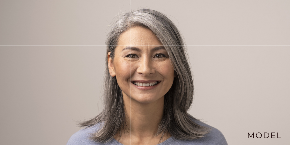 Smiling model with gray hair chattanooga periodontics dental implants